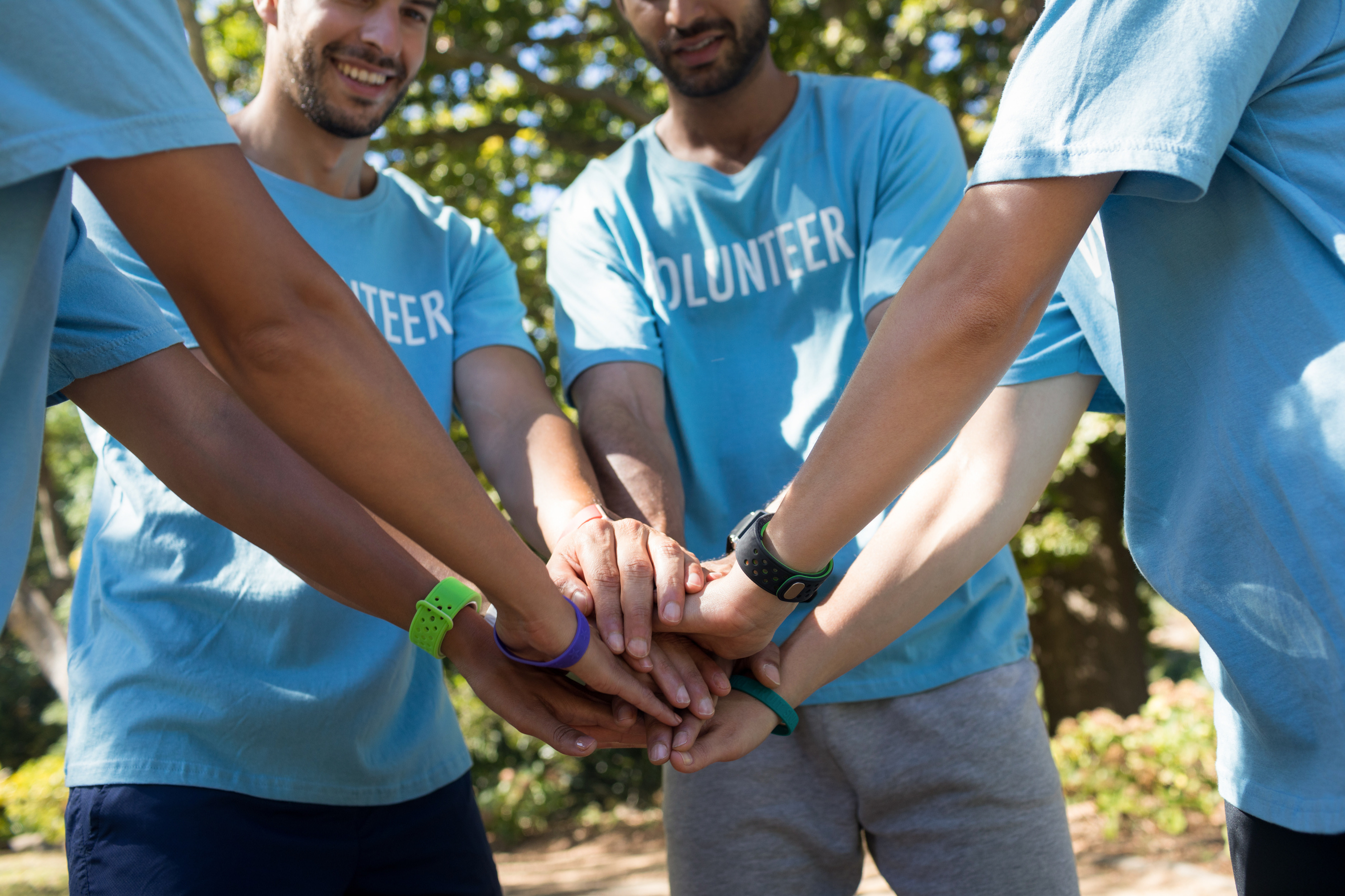Volunteers forming a hand stack